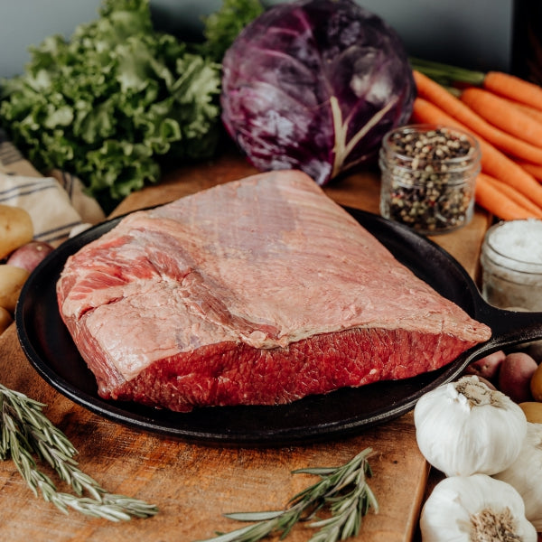Small Beef Brisket raw on skillet