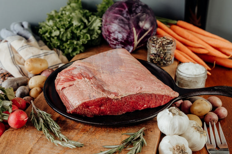 Small Beef Brisket raw on skillet