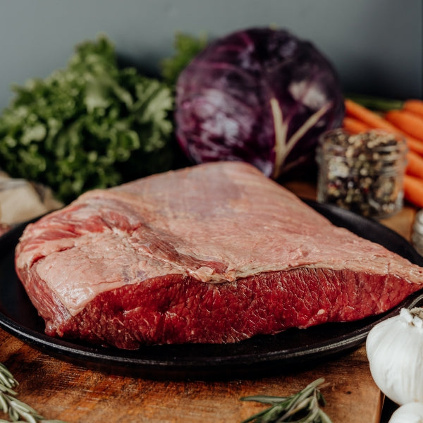 Small Beef Brisket raw on skillet
