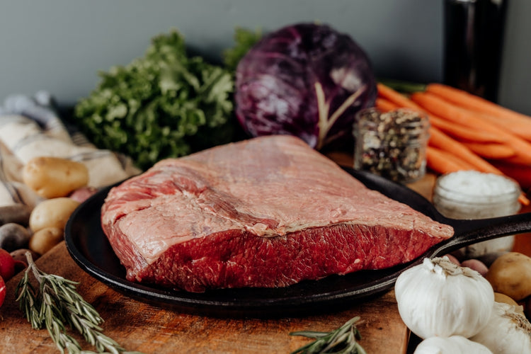 Small Beef Brisket raw on skillet