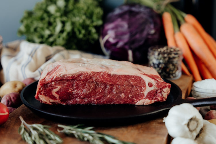 raw beef loin on skillet