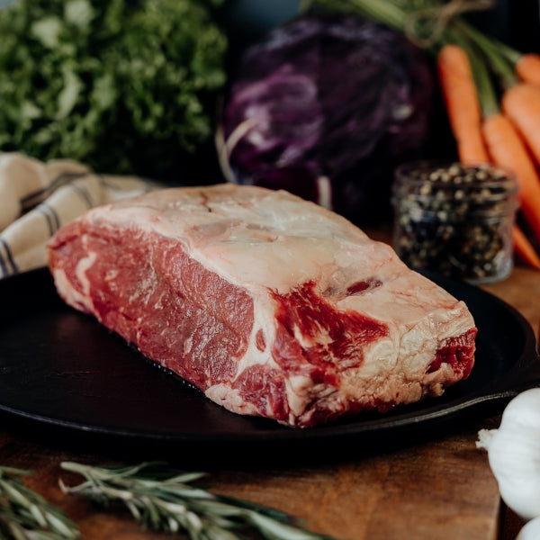 raw beef loin roast on skillet