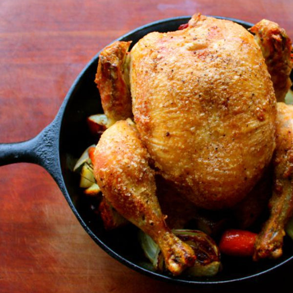 pasture-raised whole chicken roasted in cast iron pot