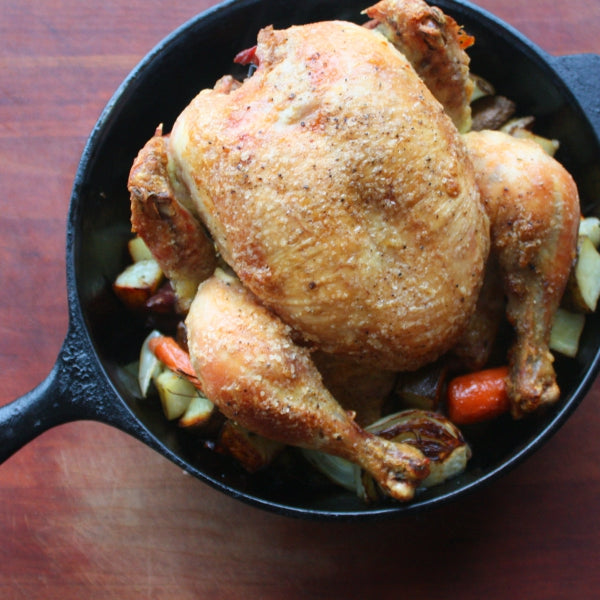 roasted whole chicken in cast iron pot