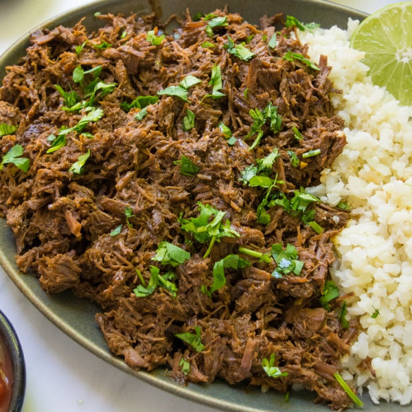 Grassfed chuck roast slow cooked shredded with cauliflower rice