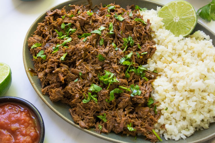 Grassfed chuck roast slow cooked shredded with cauliflower rice