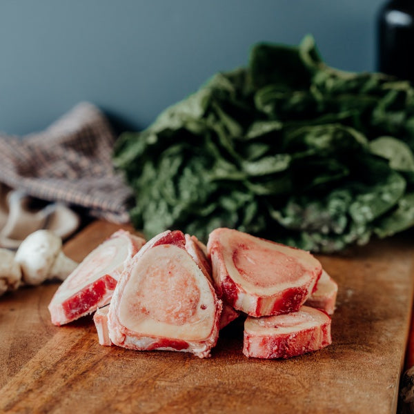 grassfed beef thin cut marrow bones on cutting board