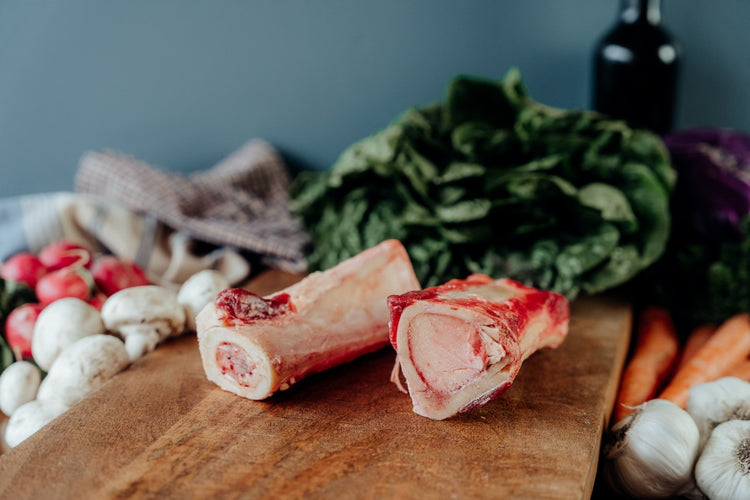 beef long marrow bones on table
