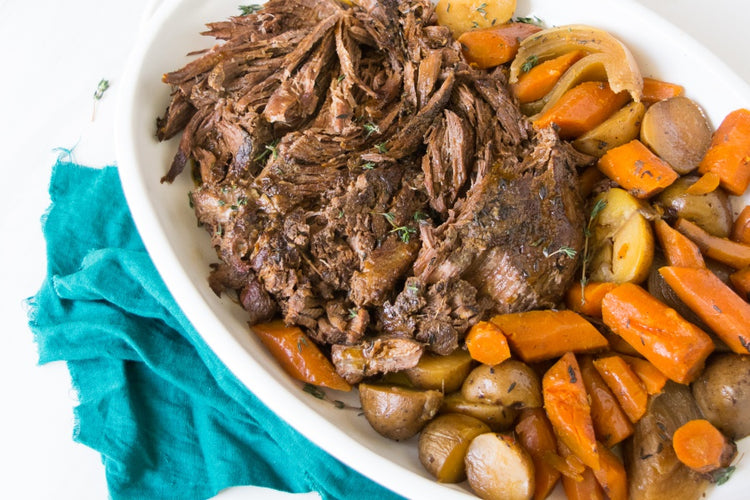 grassfed beef center cut shoulder roast slow cooked with carrots and potatoes