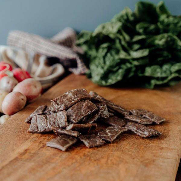 grassfed Beef Jerky End pieces on a board