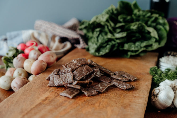 grassfed Beef Jerky End pieces on a board