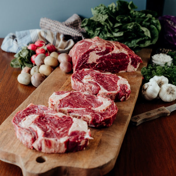 whole beef ribeye primal cut into steaks