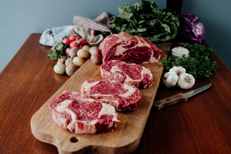 whole beef ribeye primal cut into steaks
