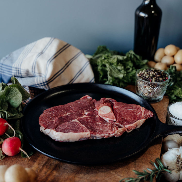 Grass-Fed Bone In Leg of Lamb Steak In Skillet