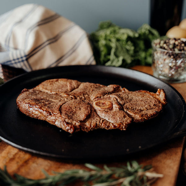 Grass-Fed Bone In Leg of Lamb Steak In Skillet