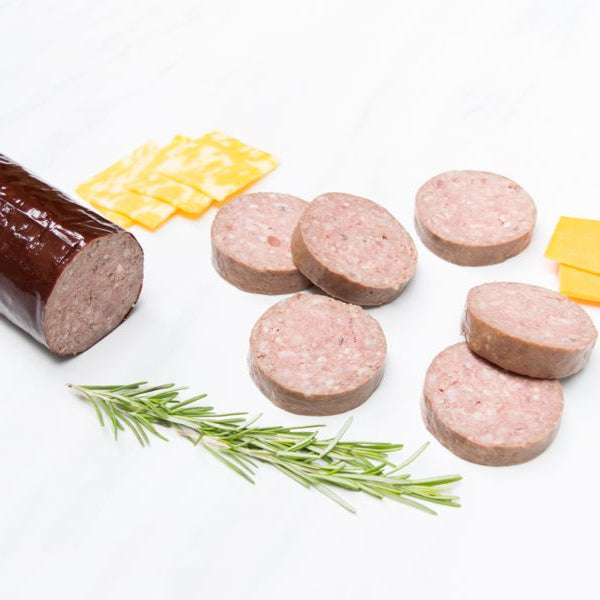 Grassfed Beef Head Cheese Sliced on cutting board