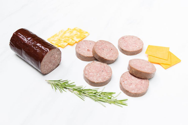 Grassfed Beef Head Cheese Sliced on cutting board