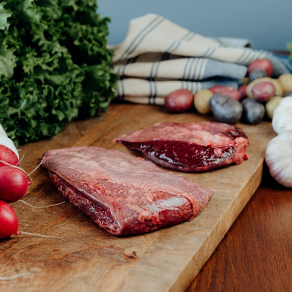 grassfed beef spleen on cutting board