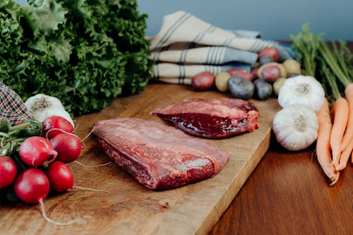grassfed beef spleen on cutting board