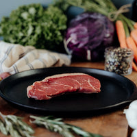 raw coulotte steak on skillet