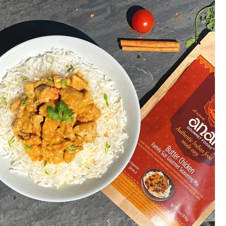 Butter Chicken dish on rice with Anand seasoning mix packaging