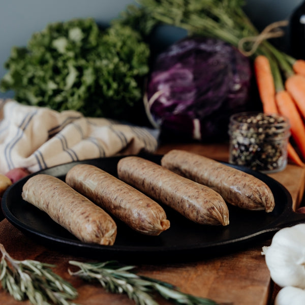 beef italian sausage links uncooked on skillet