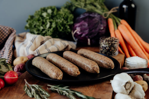 beef italian sausage links uncooked on skillet