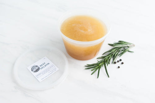 all natural grassfed beef gelatin in container with rosemary sprig