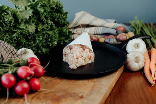 raw ground rabbit in a butcher paper cone