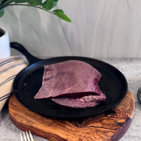 sliced beef spleen on skillet