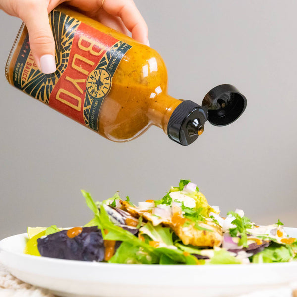 pili hunters fermented labuyo chili sauce, pouring over salad