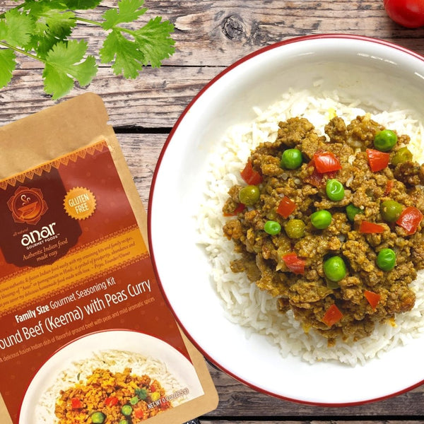 Anar seasoning kit with a bowl of beef and pea curry on rice