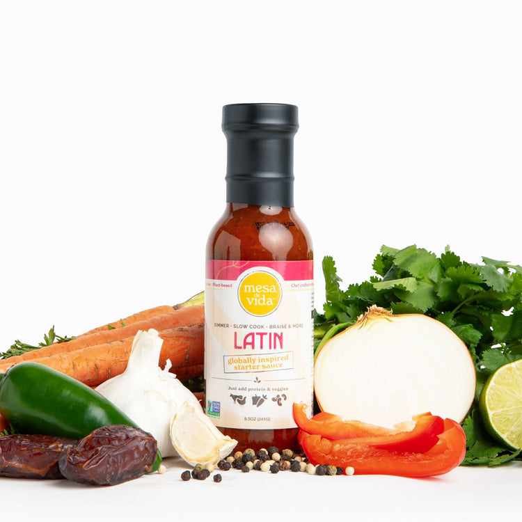 Mesa de Vida all-natural Latin meal starter sauce sitting upright on counter with vegetables