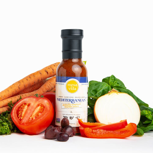 Mesa de Vida all-natural Mediterranean meal starter sauce sitting upright on counter with vegetables