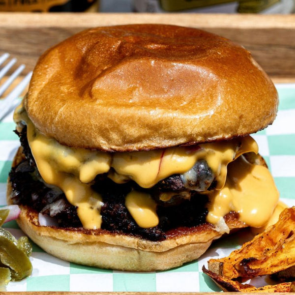 Smashburger with double beef patties, drippy melted cheese, and french fries