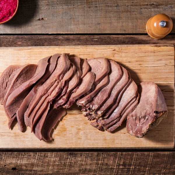 Bison Tongue sliced on cutting board