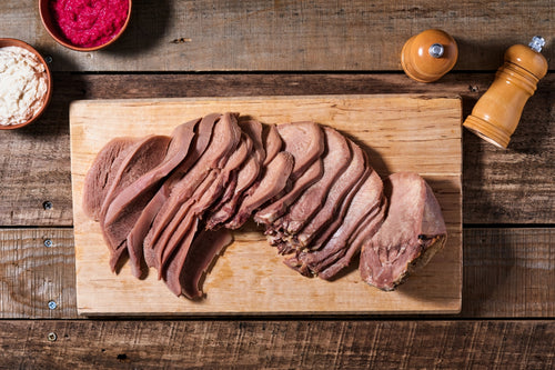 Bison Tongue sliced on cutting board