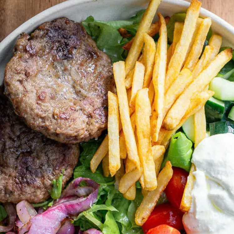 ground lamb patties on salad