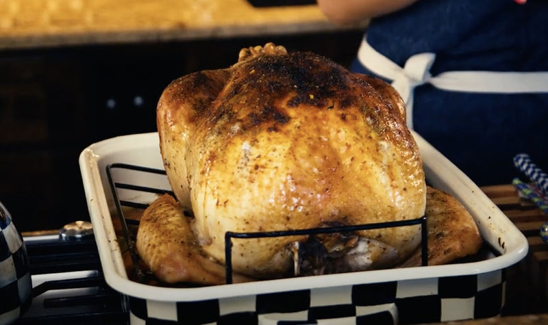 whole turkey in roasting pan