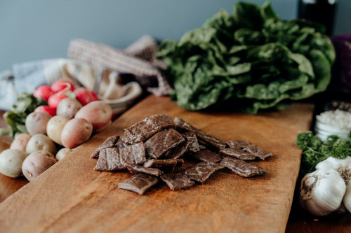 grassfed Beef Jerky End pieces on a board