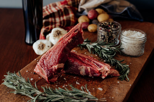 grassfed beef bone-in filet on cutting board