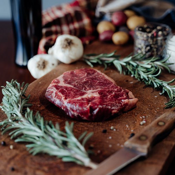 Grassfed Beef Ribeye Steak on cutting board