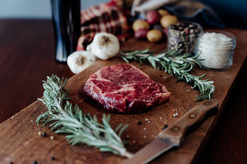 Grassfed Beef Ribeye Steak on cutting board