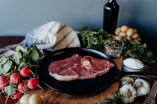 Grass-Fed Bone In Leg of Lamb Steak In Skillet